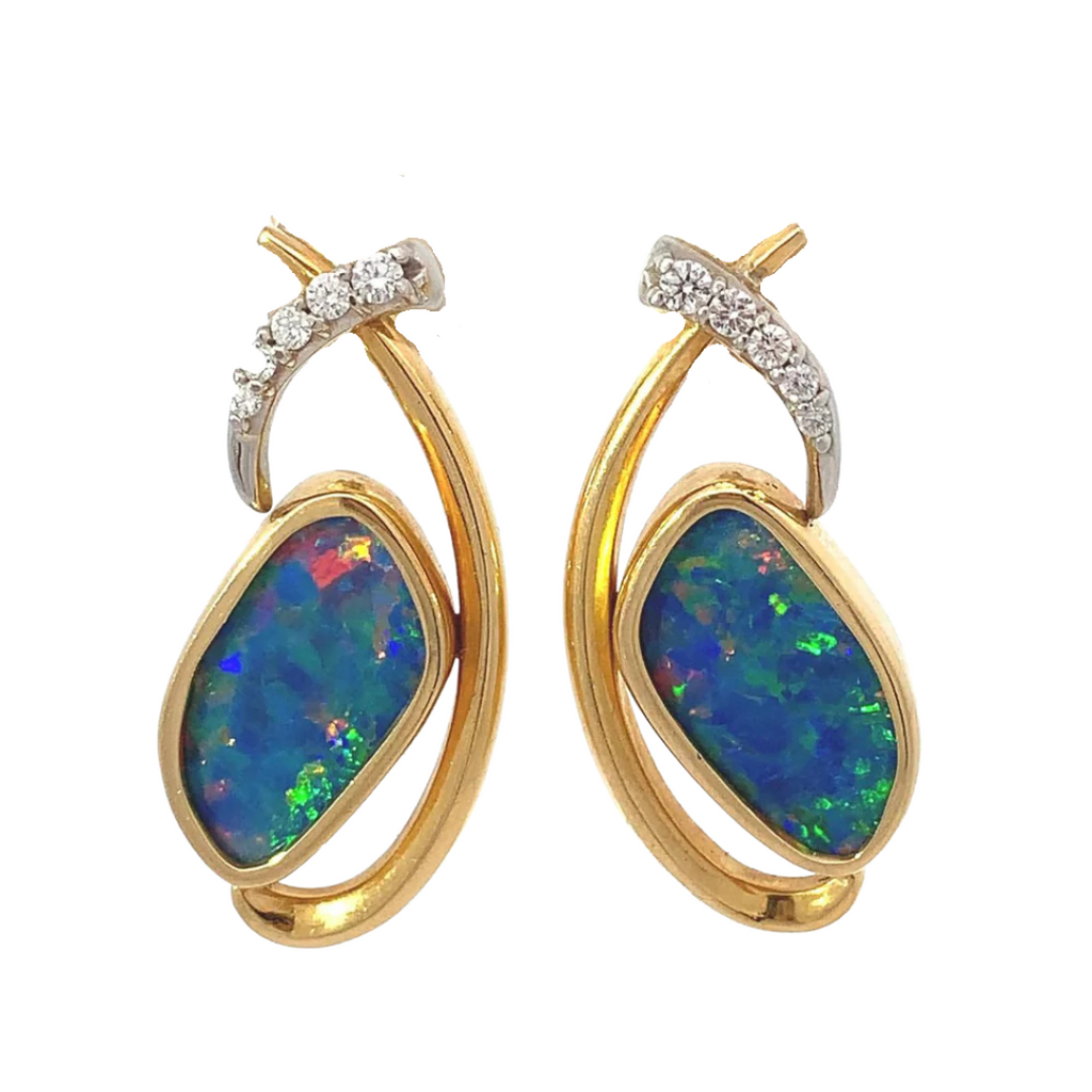 photo of custom two=tone opal and diamond earrings on a white background
