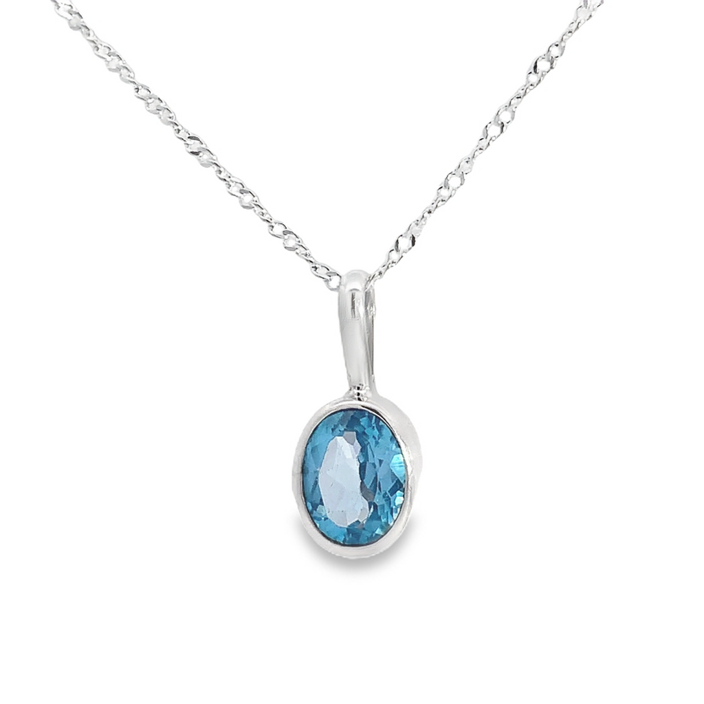 Sterling Silver Blue Topaz Pendant Necklace-Guillermo Arregui's Oval Bezel Set Blue Topaz Pendant On Cable Chain