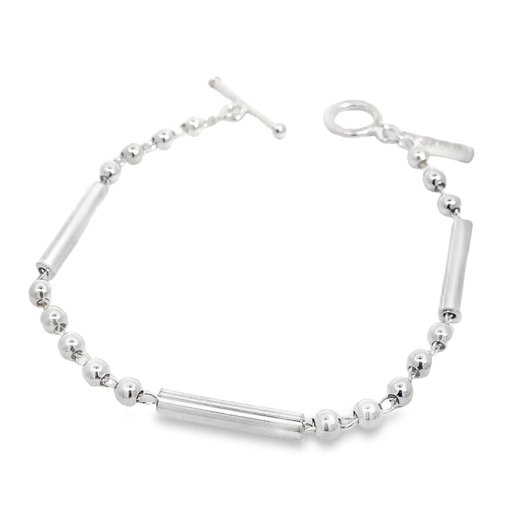 photo of a silver link bracelet made of bars and ball on a white background 