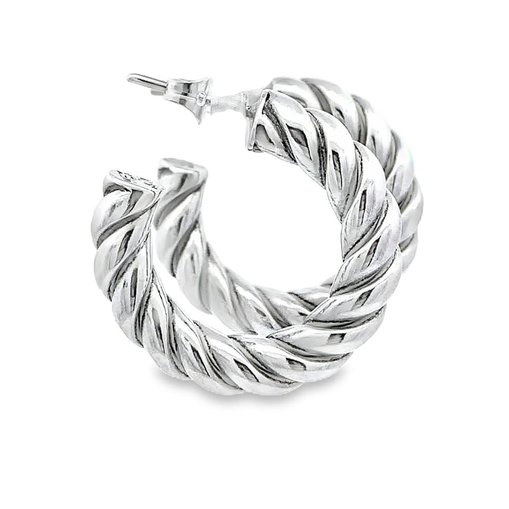 photo of silver twisted hoop earrings on a white background 