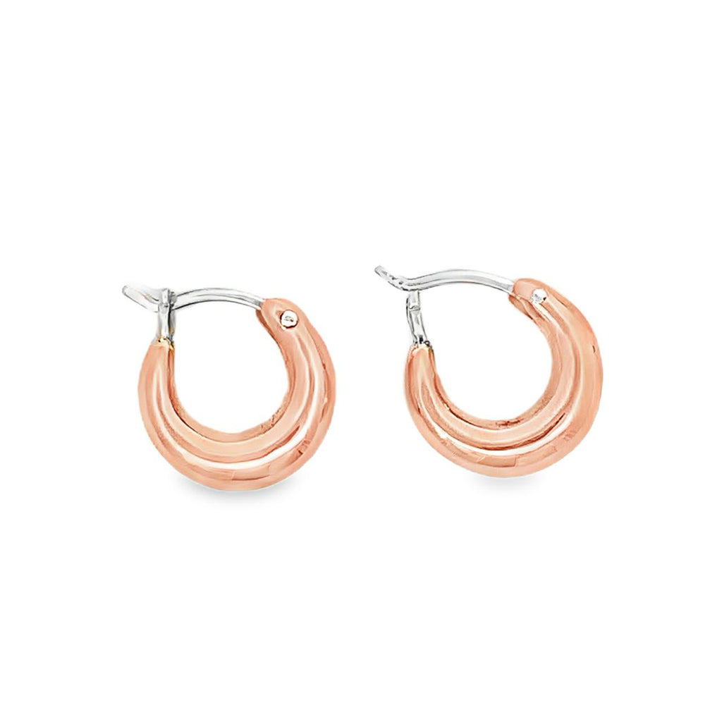 photo of a pair of copper hoop earrings on a white background