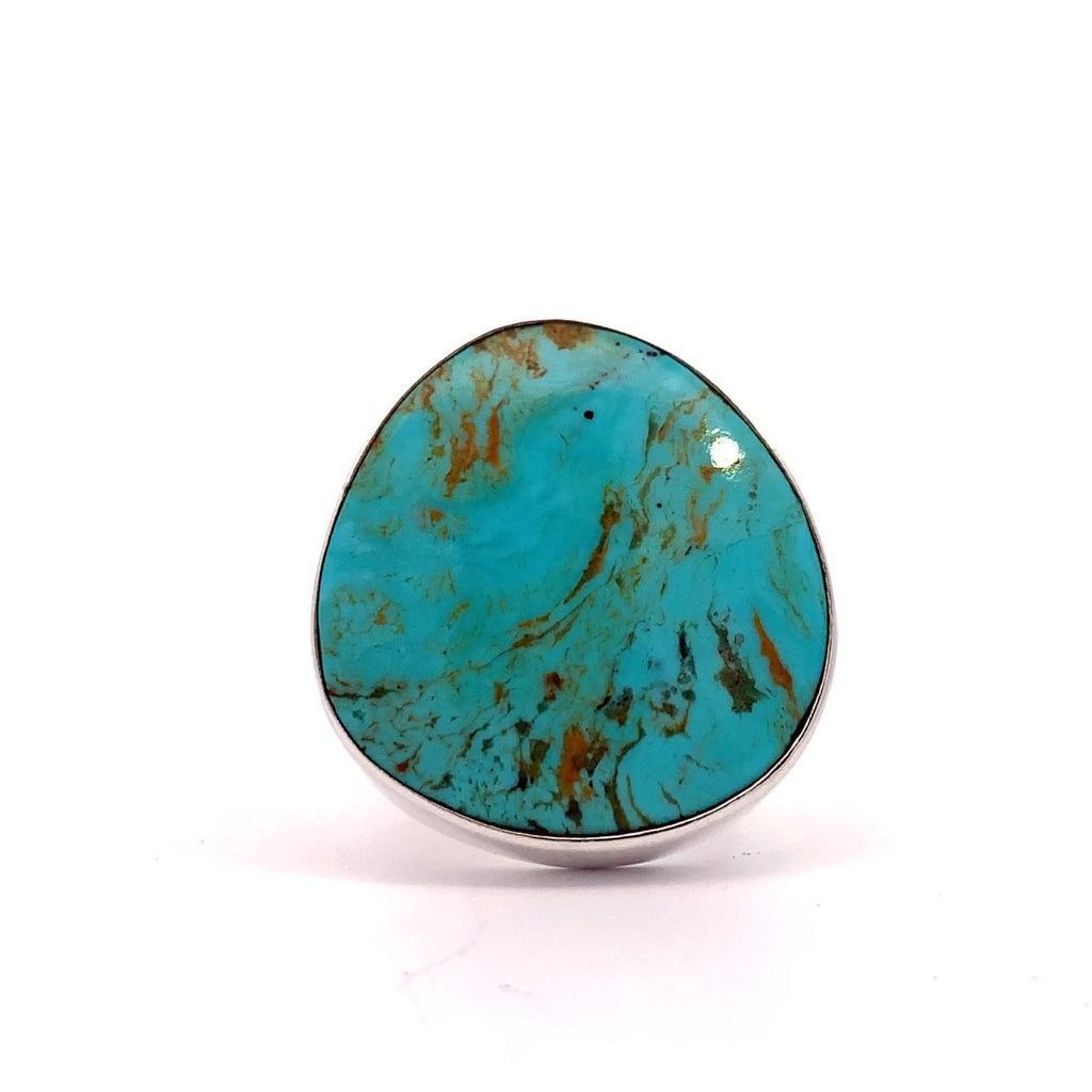 photo of a silver roundish Turquoise ring on a white background