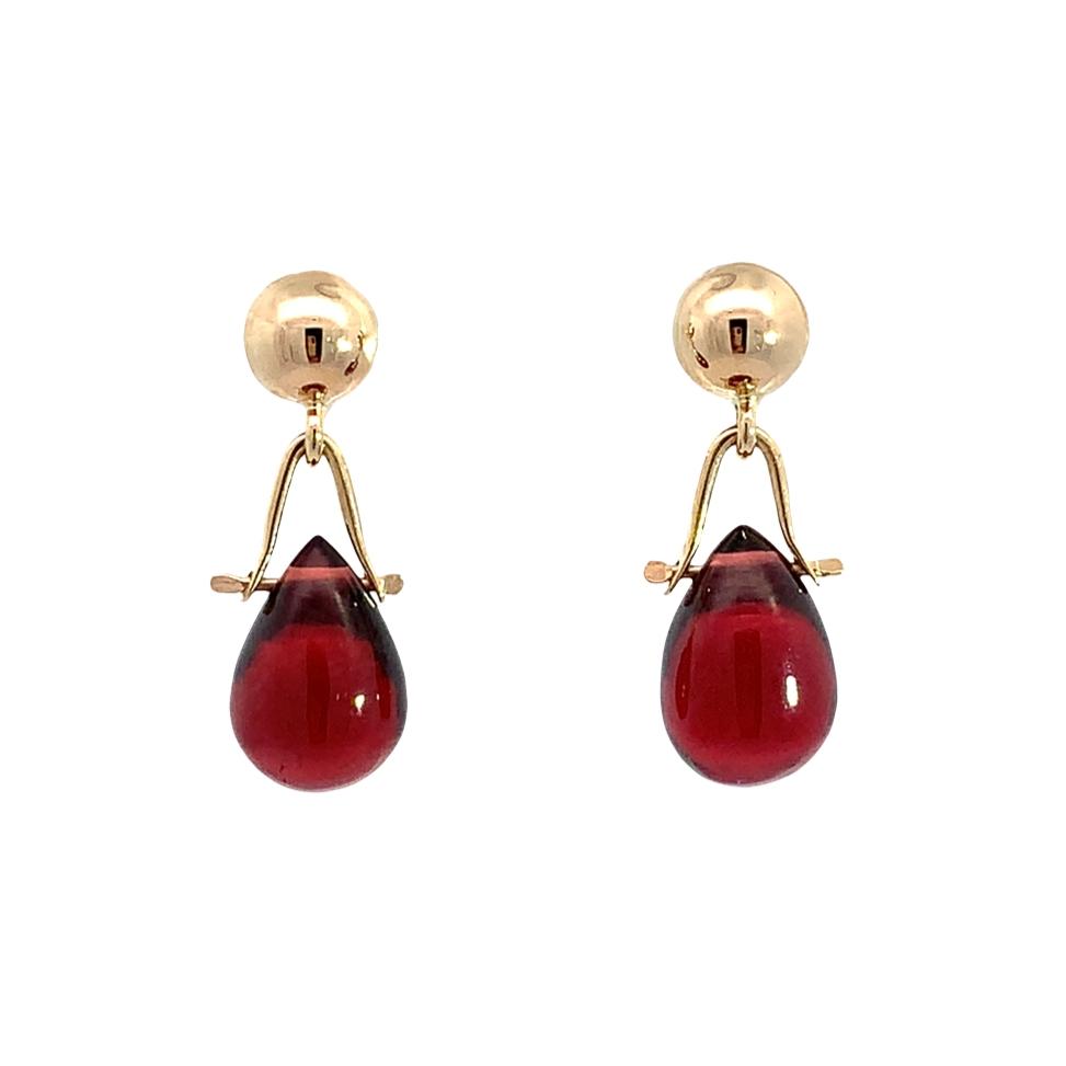 photo of a pair of yellow gold garnet drop briolette earrings on a white background
