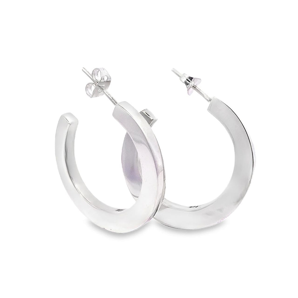 photo of silver hoop earrings on a white background