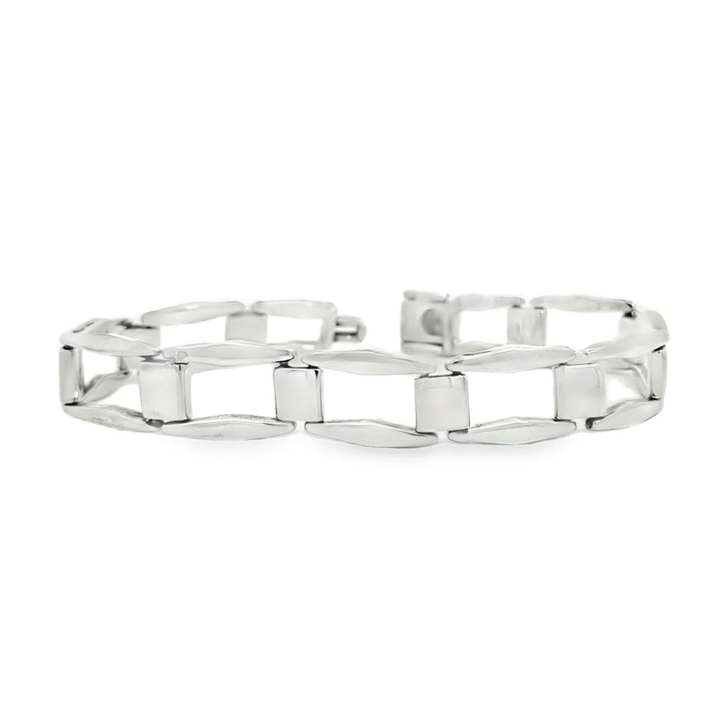 photo of a silver rectangular link bracelet on a white background