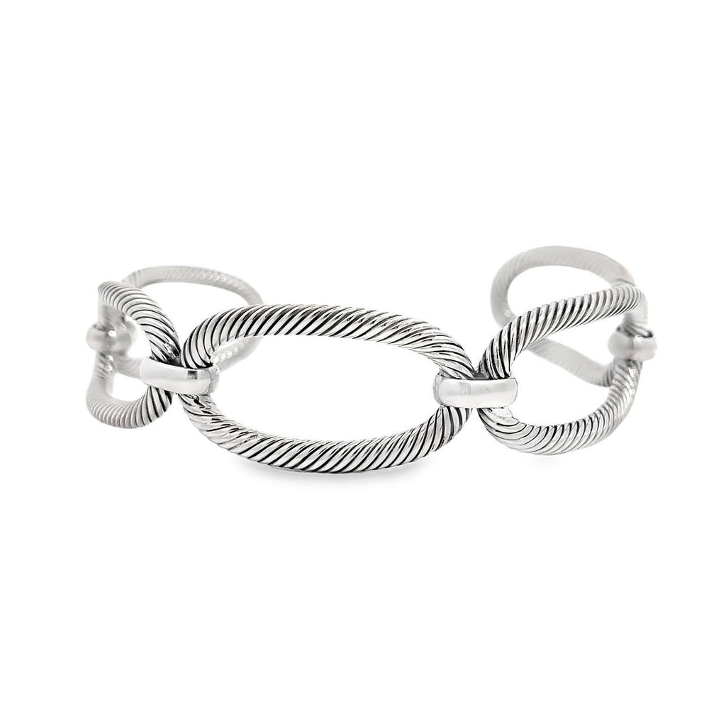 photo of a five oval link twisted sterling silver cuff bracelet on a white background