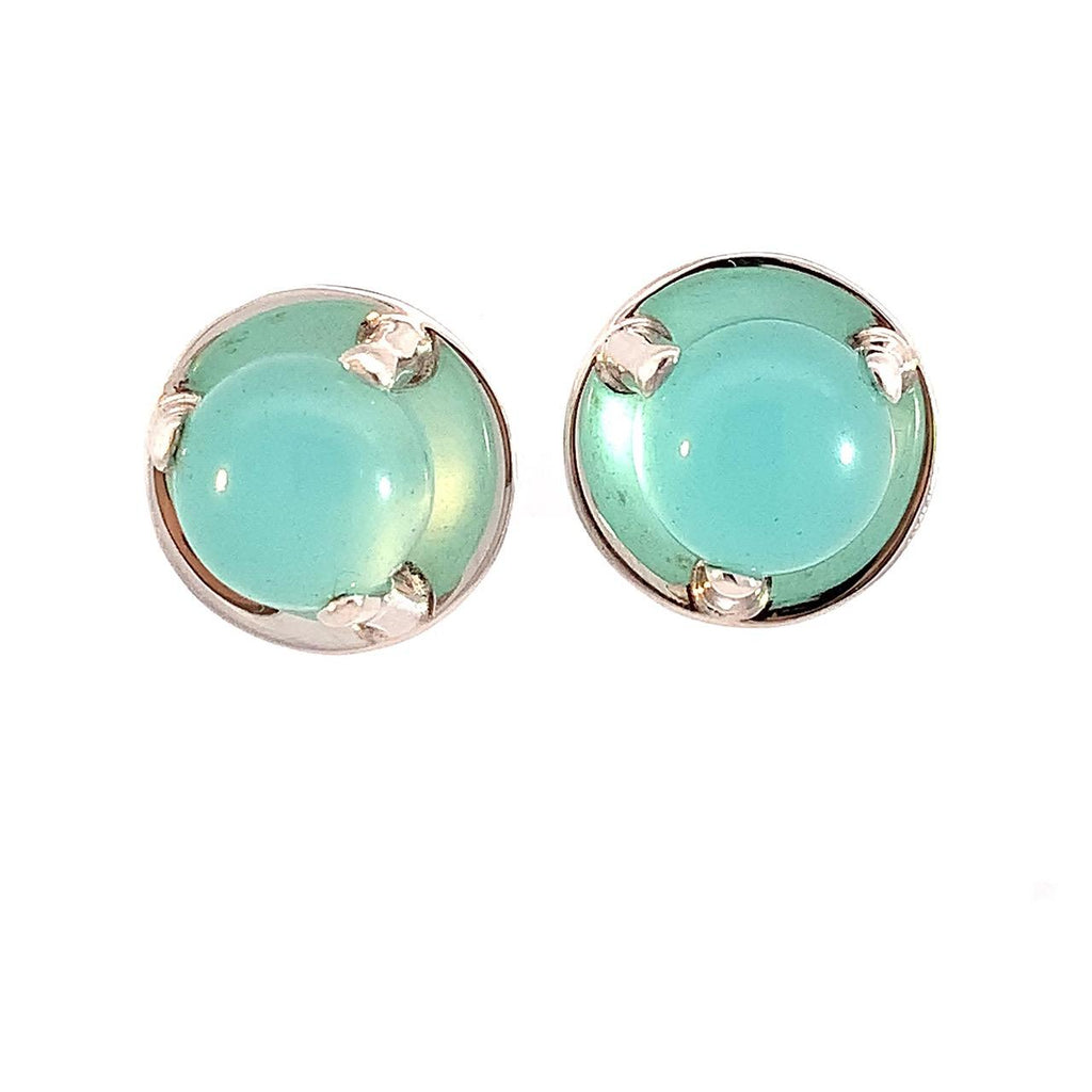 photo of silver earrings set with a blue chalcedony cabachon on a white background