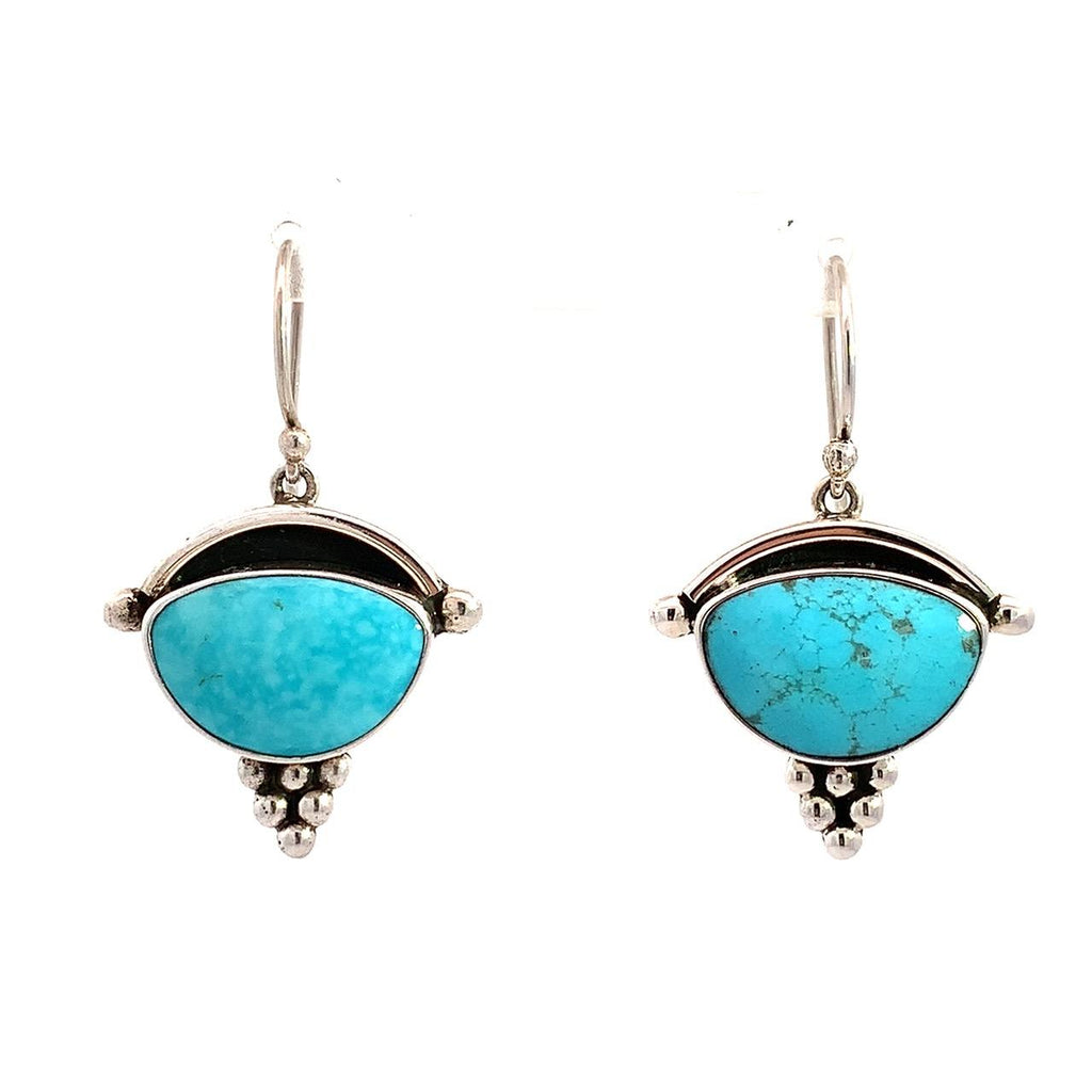 Taxco sterling silver earrings with half moon turquoise bezel set stones and silver bead detail by Guillermo Arregui