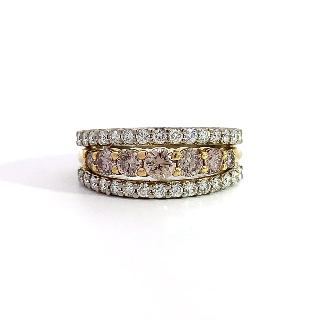 photo of a custom 14k yellow and white gold natural champagne and white diamond three-row band on a white background